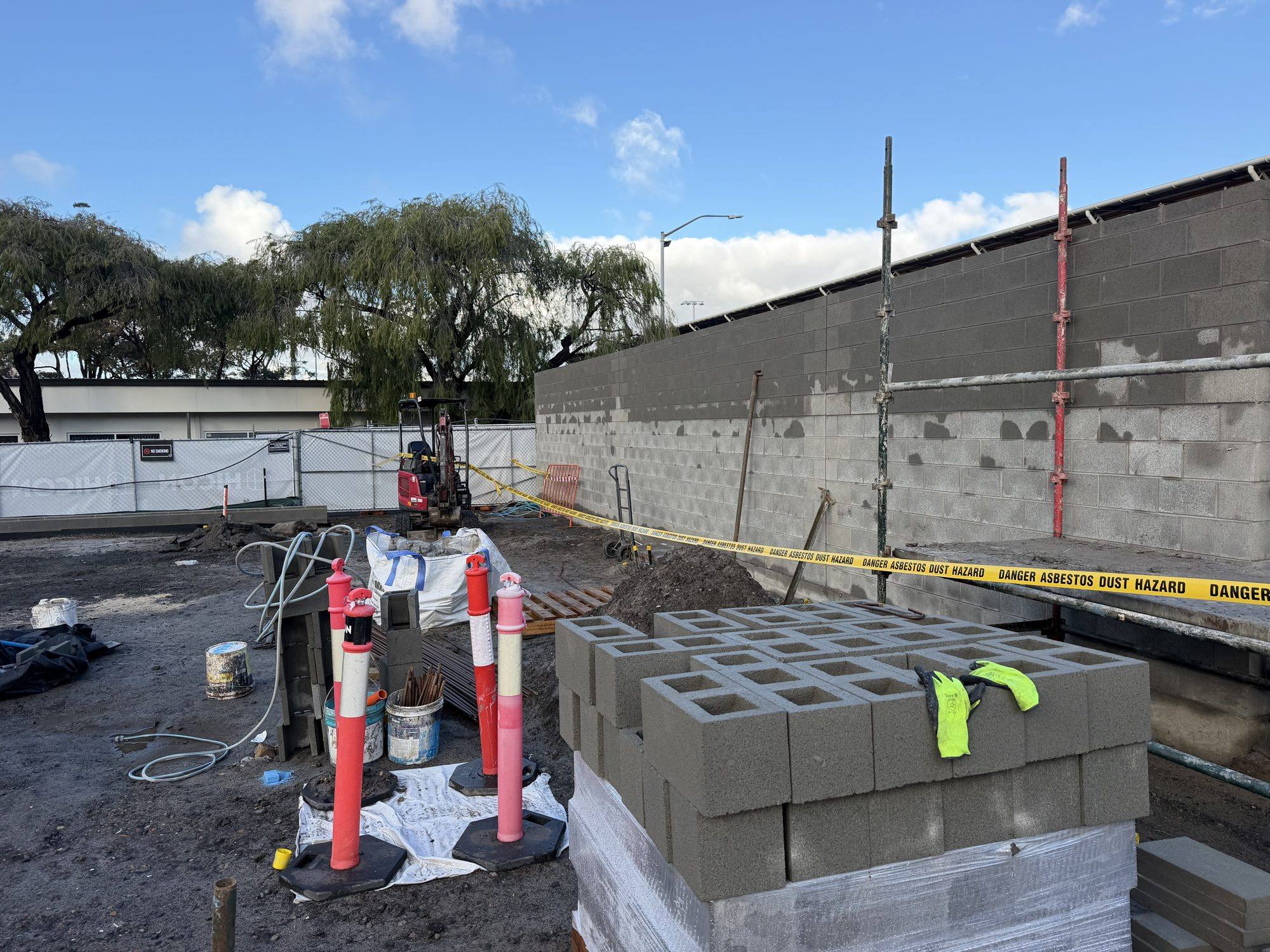 Danger asbestos hazard tape demarcating the excavation at a Sydney Airport project