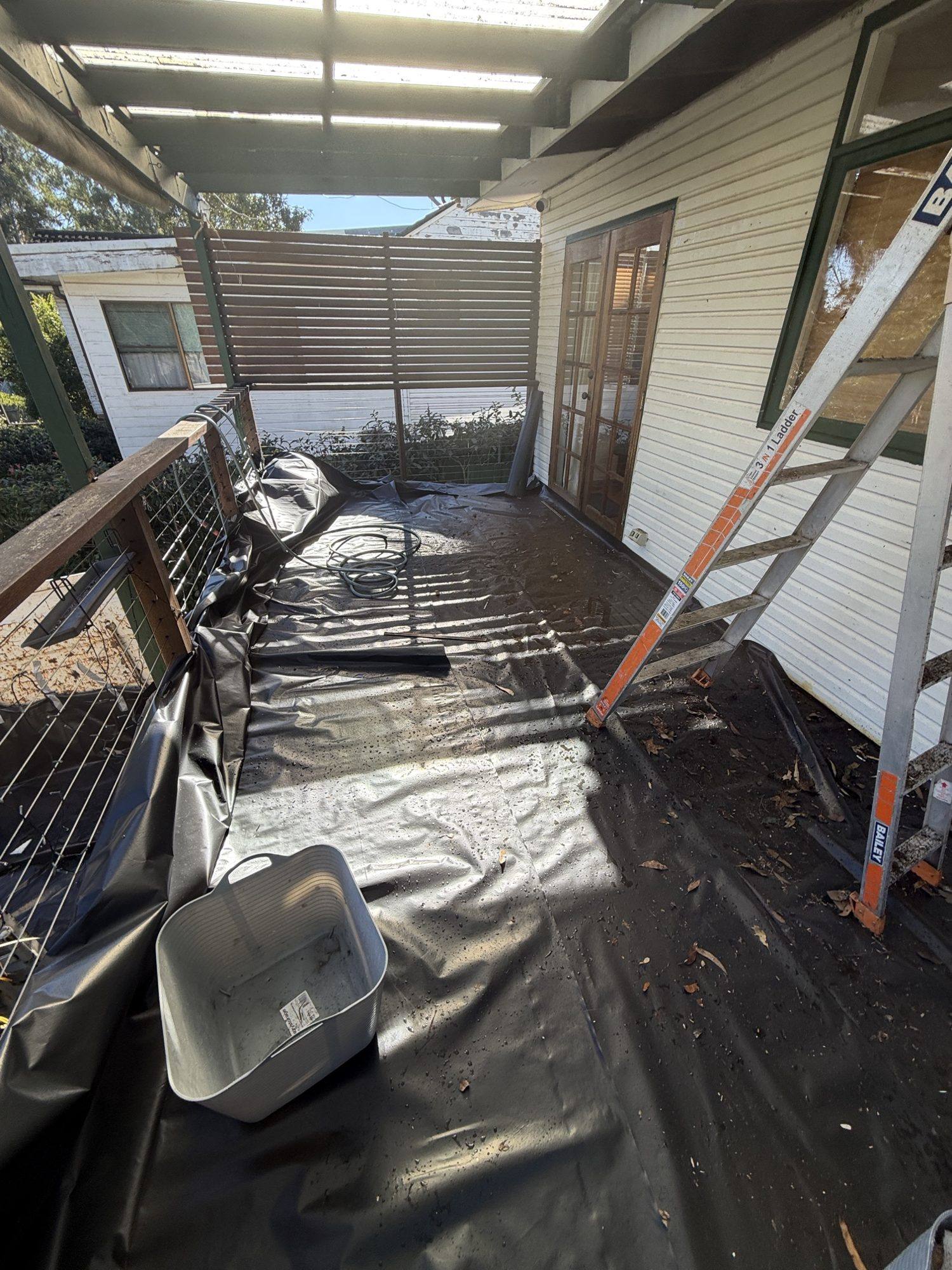 HazWreck crew working under containment on a residential asbestos eaves removal in Asquith