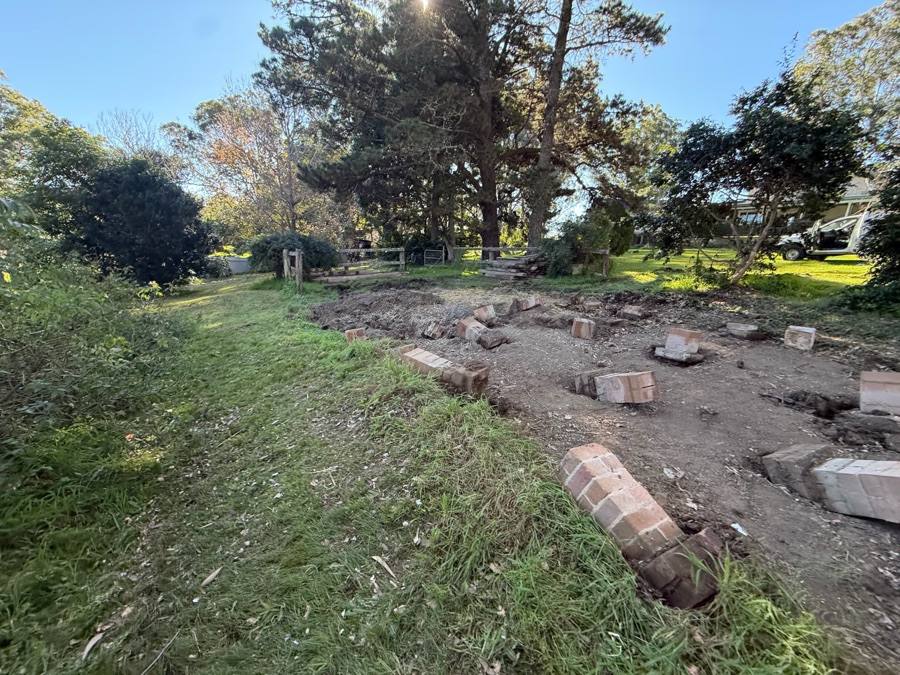 Brick pier footings exposed once the asbestos shed structure was removed