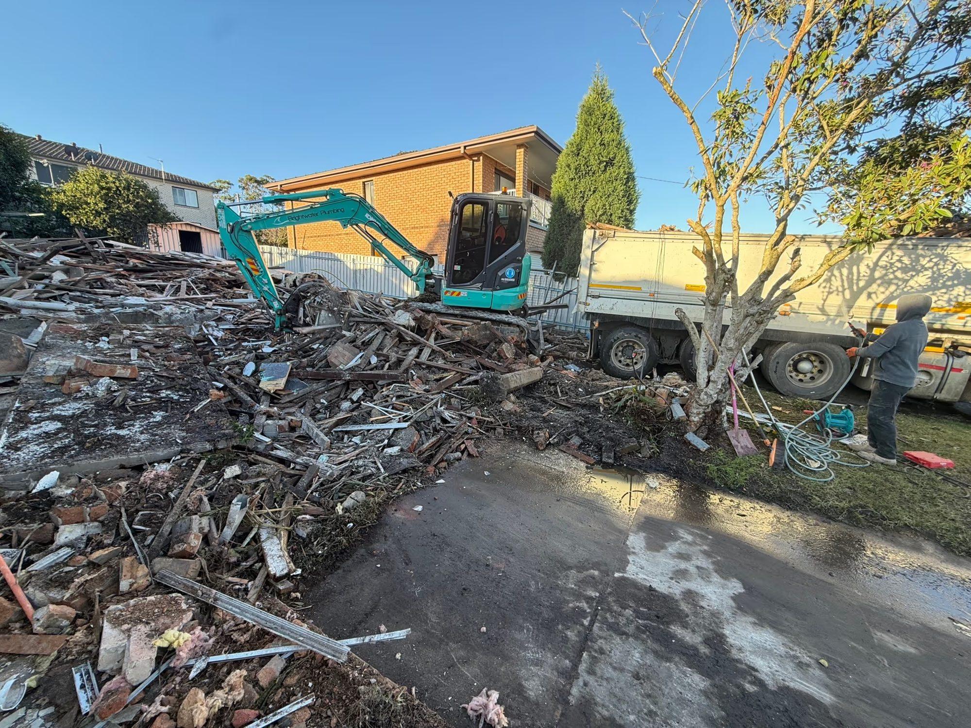 HazWreck excavator working through the demolished Lambton house
