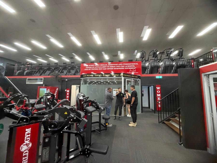 A commercial tenancy before clearance — gym fitout and contents still in place